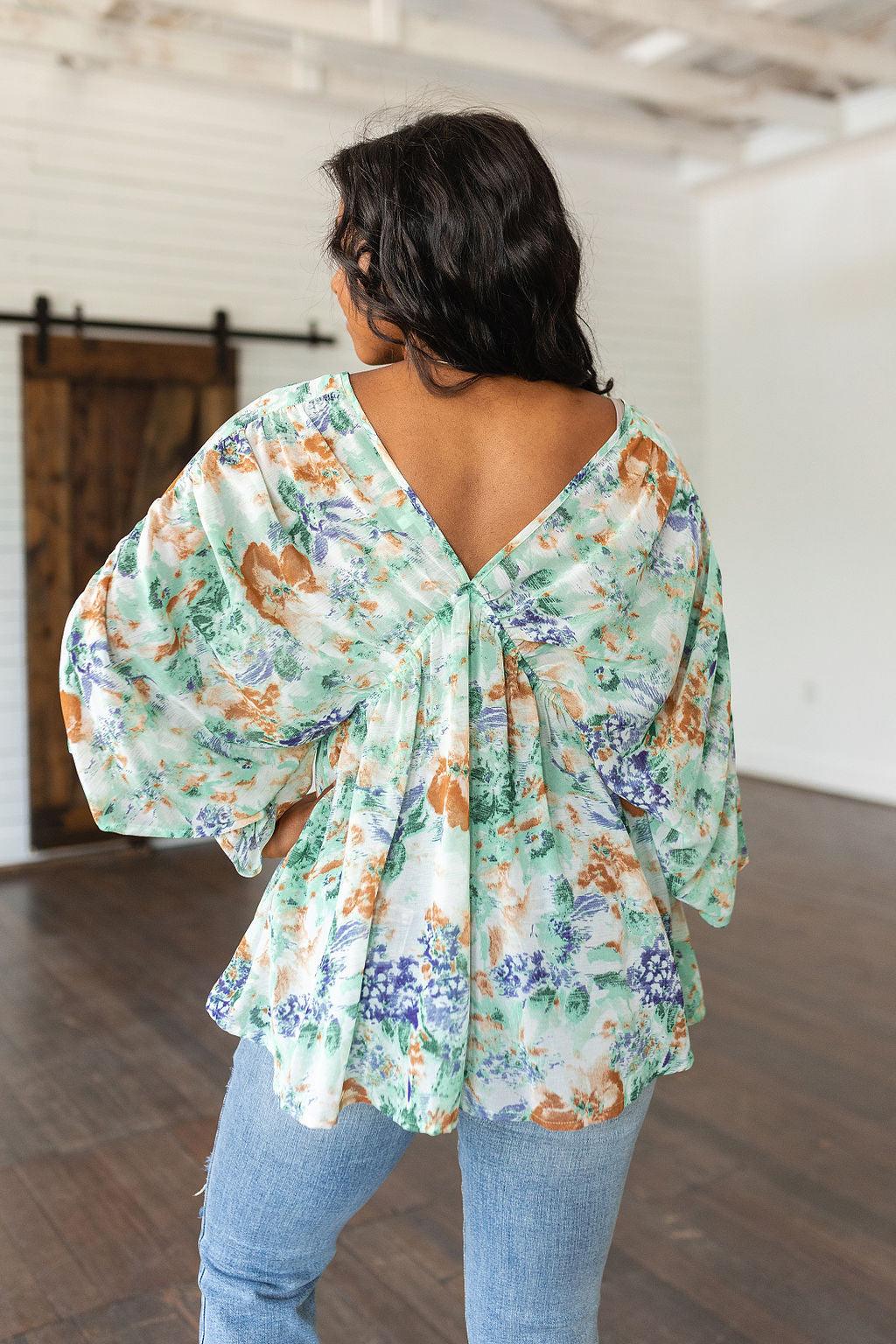 Fabled in Floral Draped Peplum Top in Ivory - Waverly Paige Boutique